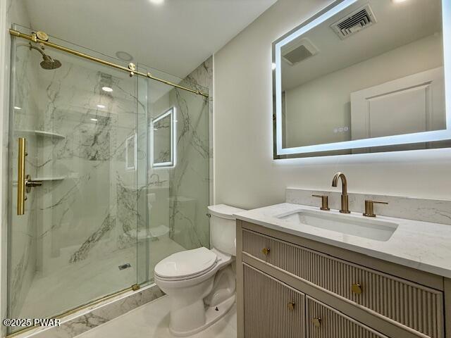 404 Forest Dr, Lords Valley, PA 18428 - full bath featuring vanity, a marble finish shower, and toilet
