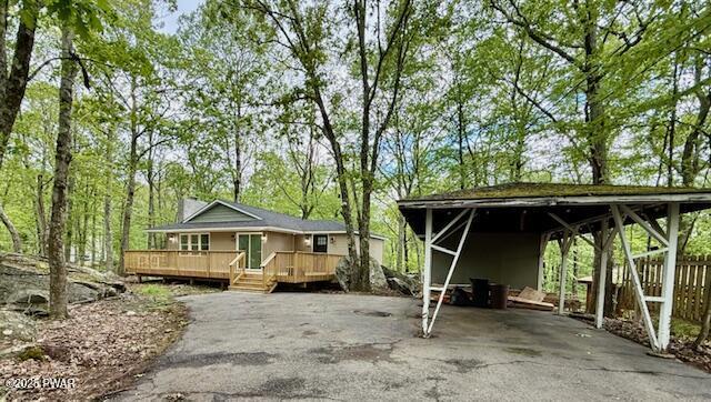 404 Forest Dr, Lords Valley, PA 18428 - view of front of home with asphalt driveway and a wooden deck