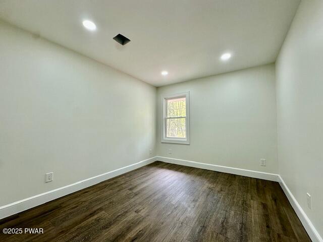 404 Forest Dr, Lords Valley, PA 18428 - empty room featuring dark wood-type flooring, baseboards, and recessed lighting