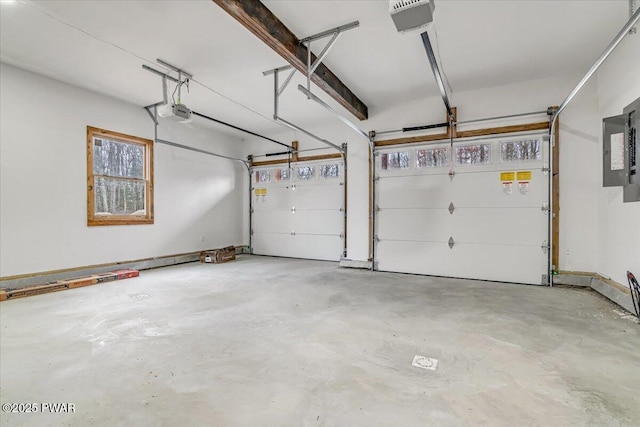 garage featuring electric panel and a garage door opener