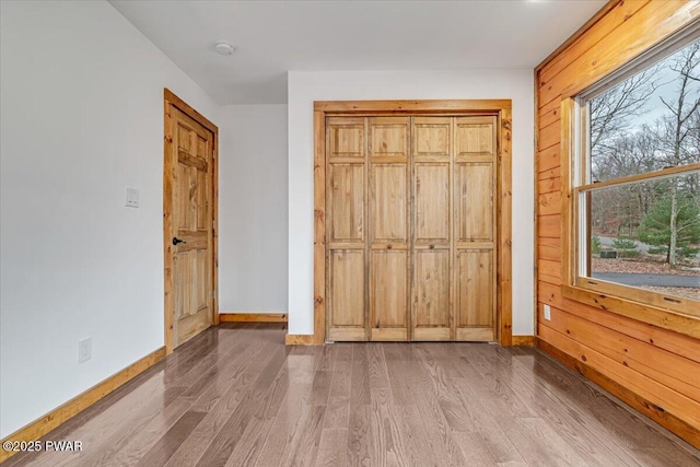 unfurnished bedroom with light wood-type flooring