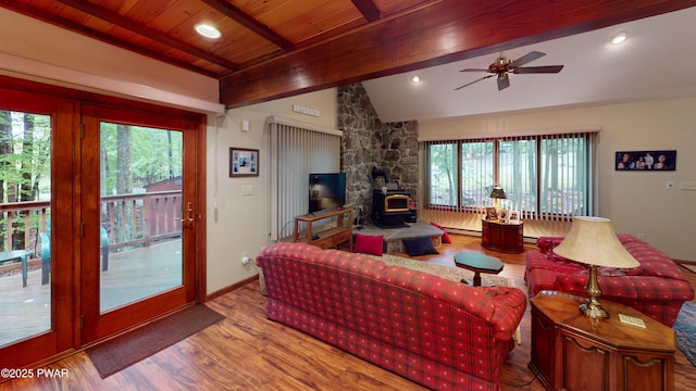 726 Wildwood Ter, Lake Ariel, PA 18436 - living area with a wood stove, ceiling fan, wood finished floors, plenty of natural light, and wood ceiling