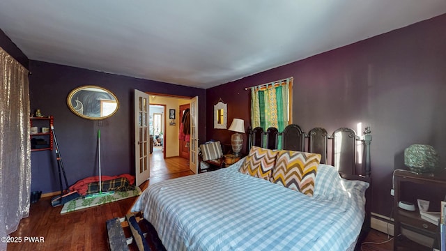 bedroom featuring wood finished floors