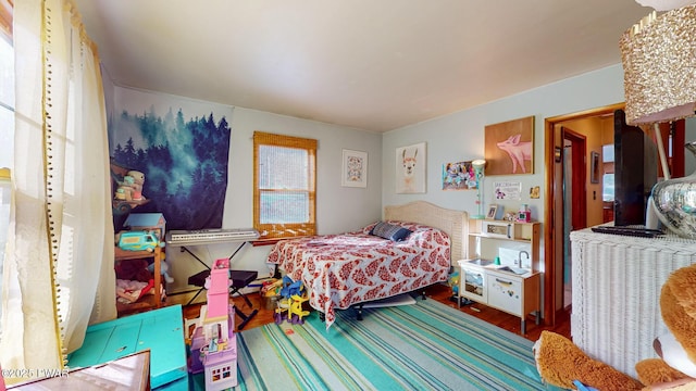 bedroom with wood finished floors