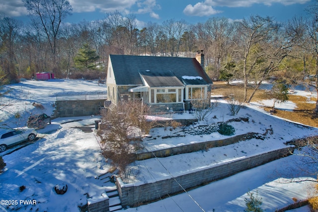 view of front of home featuring a chimney