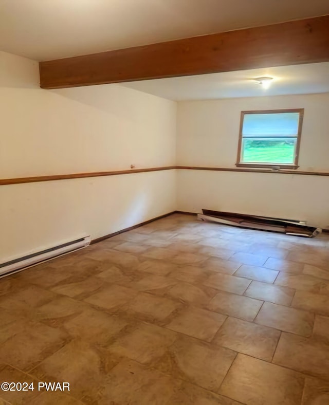 empty room with beamed ceiling and a baseboard heating unit