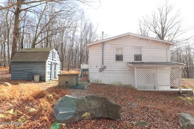 view of side of home with a garage and an outdoor structure