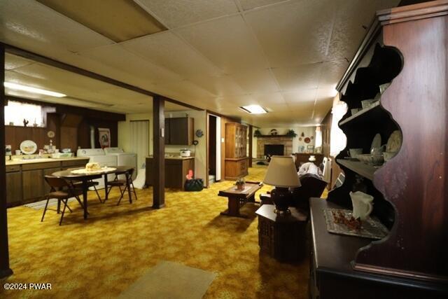 interior space featuring carpet flooring and washing machine and dryer