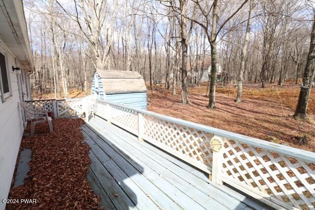 wooden deck with a storage unit