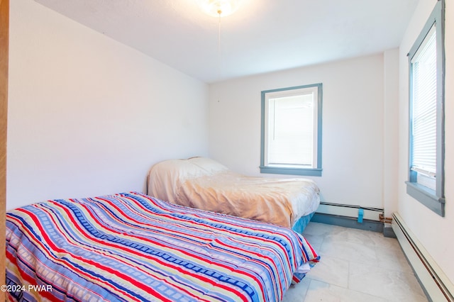 bedroom featuring a baseboard radiator