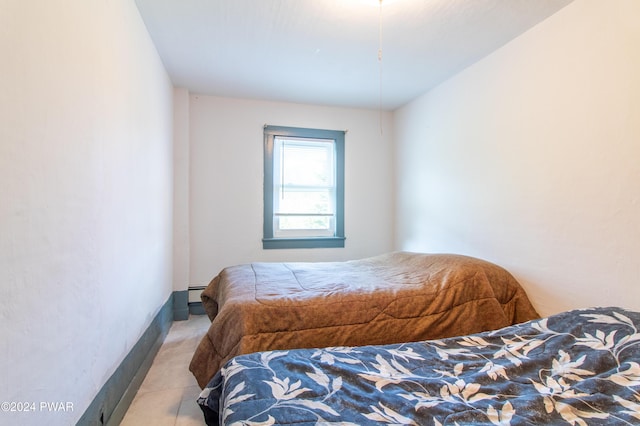 bedroom featuring a baseboard heating unit