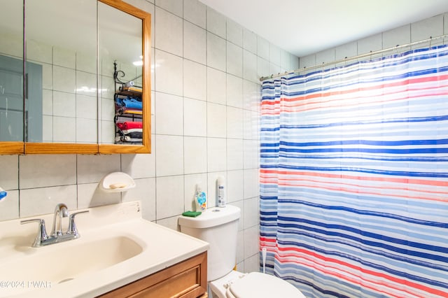 bathroom with tasteful backsplash, a shower with curtain, vanity, tile walls, and toilet