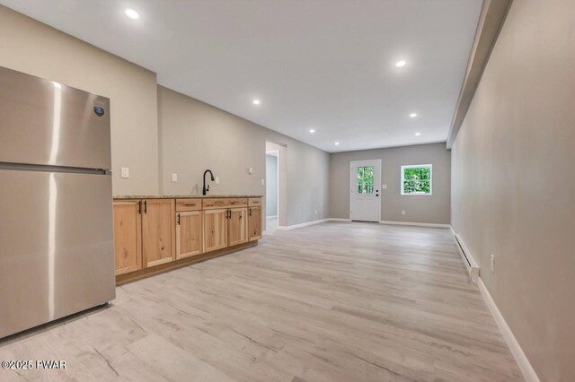 103 Goldrush Dr, Lords Valley, PA 18428 - unfurnished living room with a baseboard heating unit, light wood finished floors, and recessed lighting