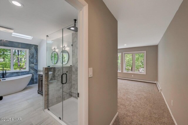 103 Goldrush Dr, Lords Valley, PA 18428 - bathroom featuring a shower stall, baseboard heating, a freestanding tub, and recessed lighting