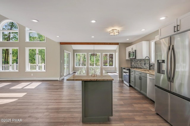 103 Goldrush Dr, Lords Valley, PA 18428 - kitchen featuring stainless steel appliances, plenty of natural light, dark wood-style floors, a kitchen island, and recessed lighting