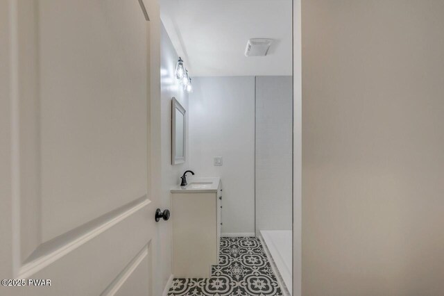 103 Goldrush Dr, Lords Valley, PA 18428 - bathroom with vanity, tile patterned floors, and a shower