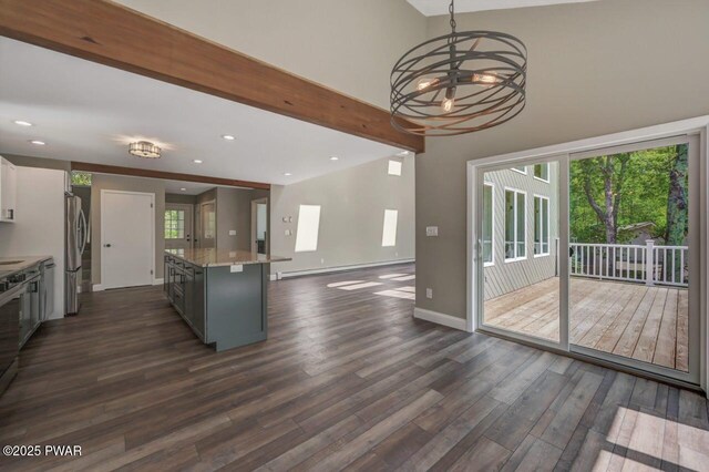 103 Goldrush Dr, Lords Valley, PA 18428 - kitchen featuring freestanding refrigerator, a baseboard heating unit, dark wood-type flooring, a center island, and recessed lighting