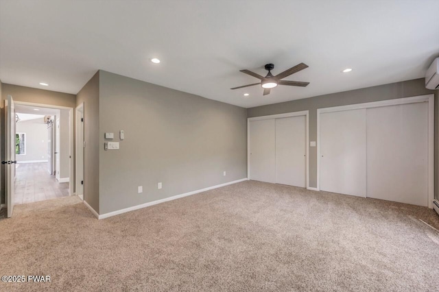 103 Goldrush Dr, Lords Valley, PA 18428 - unfurnished bedroom featuring multiple closets, carpet floors, recessed lighting, ceiling fan, and a wall unit AC