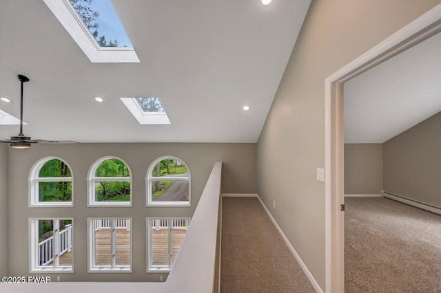 103 Goldrush Dr, Lords Valley, PA 18428 - hall featuring a skylight, baseboard heating, carpet flooring, vaulted ceiling, and recessed lighting