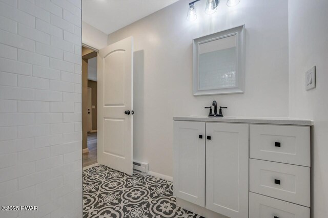 103 Goldrush Dr, Lords Valley, PA 18428 - bathroom featuring baseboard heating, vanity, and tile patterned floors