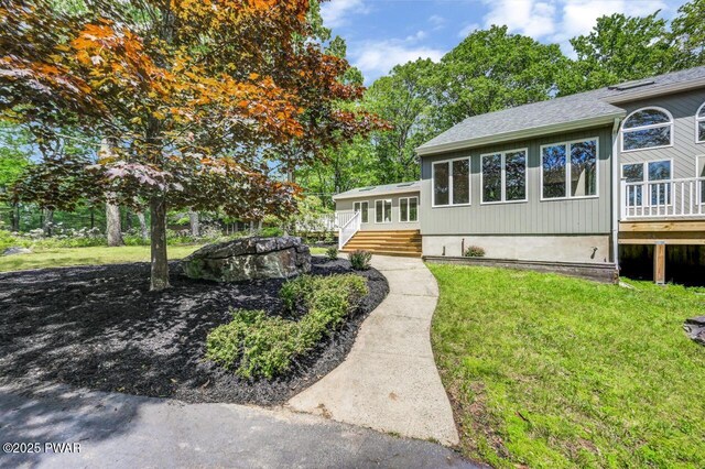 103 Goldrush Dr, Lords Valley, PA 18428 - view of front of home featuring a front yard and a deck
