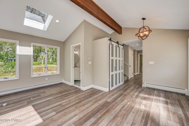 103 Goldrush Dr, Lords Valley, PA 18428 - empty room featuring a baseboard radiator, a barn door, wood finished floors, a chandelier, and recessed lighting