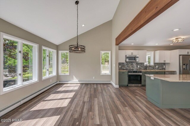 103 Goldrush Dr, Lords Valley, PA 18428 - kitchen featuring appliances with stainless steel finishes, a baseboard heating unit, white cabinets, plenty of natural light, and recessed lighting