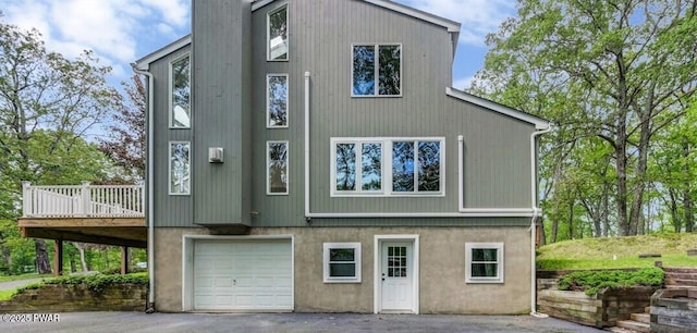 103 Goldrush Dr, Lords Valley, PA 18428 - view of front of property featuring an attached garage, a deck, and driveway