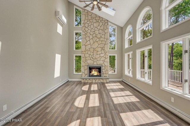 103 Goldrush Dr, Lords Valley, PA 18428 - unfurnished living room featuring a baseboard heating unit, high vaulted ceiling, ceiling fan, a fireplace, and wood finished floors