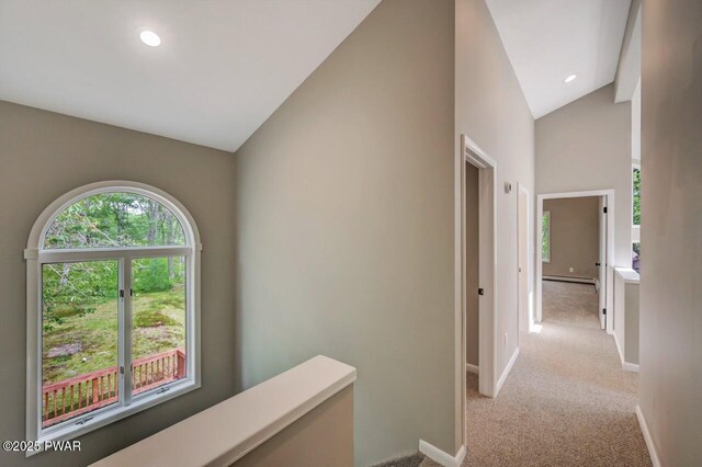 103 Goldrush Dr, Lords Valley, PA 18428 - hall with light carpet, lofted ceiling, a baseboard heating unit, and recessed lighting