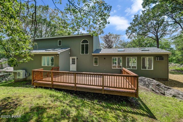 103 Goldrush Dr, Lords Valley, PA 18428 - back of house with a wooden deck and a lawn