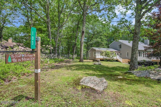 103 Goldrush Dr, Lords Valley, PA 18428 - view of green lawn with a wooden deck