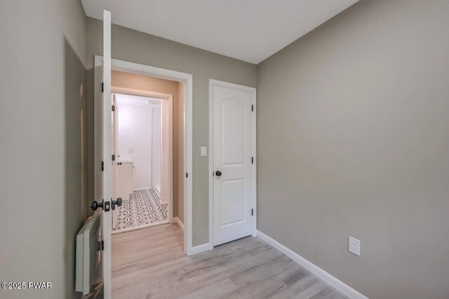 103 Goldrush Dr, Lords Valley, PA 18428 - hall featuring light wood-style floors and radiator heating unit
