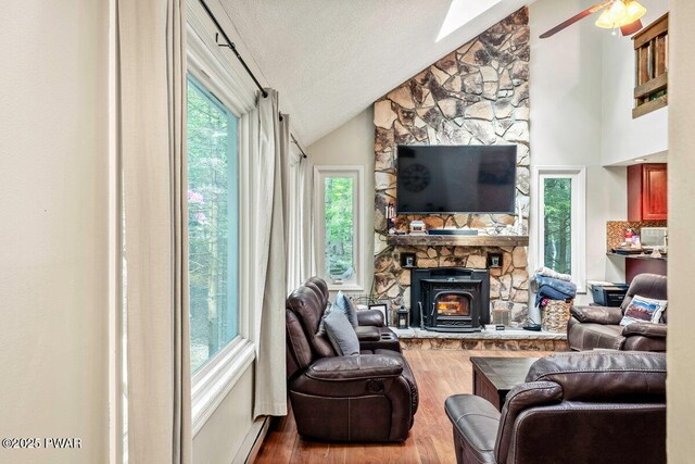 108 Bayberry Ct, East Stroudsburg, PA 18301 - living area with vaulted ceiling, wood finished floors, healthy amount of natural light, ceiling fan, and a textured ceiling