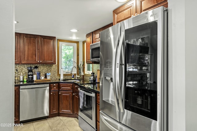 108 Bayberry Ct, East Stroudsburg, PA 18301 - kitchen with appliances with stainless steel finishes, a sink, decorative backsplash, light tile patterned flooring, and recessed lighting