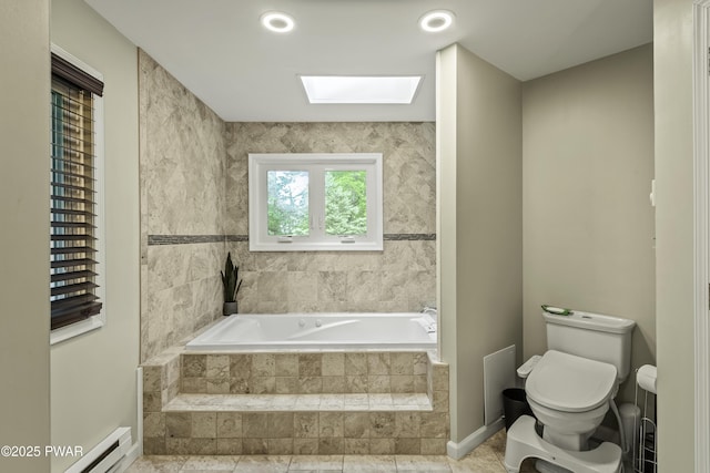 108 Bayberry Ct, East Stroudsburg, PA 18301 - bathroom featuring toilet, a skylight, a bath, a baseboard heating unit, and baseboards