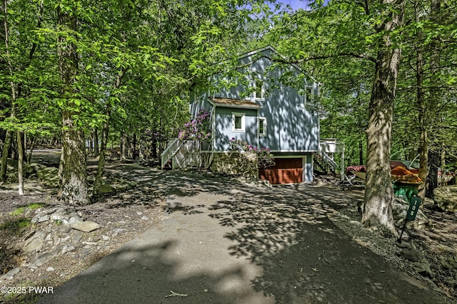 108 Bayberry Ct, East Stroudsburg, PA 18301 - view of front of property with an attached garage, driveway, and stairway
