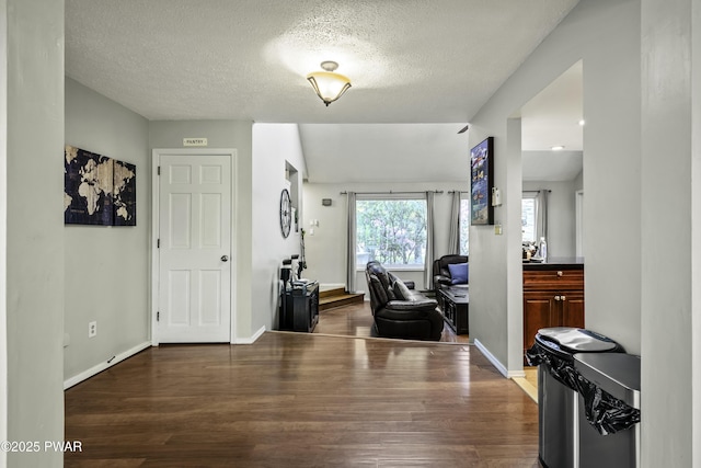 108 Bayberry Ct, East Stroudsburg, PA 18301 - foyer entrance with dark wood-style floors, a textured ceiling, and baseboards