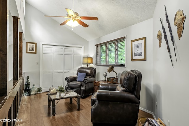 108 Bayberry Ct, East Stroudsburg, PA 18301 - living room featuring a ceiling fan, vaulted ceiling, wood finished floors, and a textured ceiling