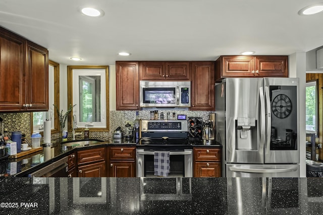 108 Bayberry Ct, East Stroudsburg, PA 18301 - kitchen with appliances with stainless steel finishes, a sink, tasteful backsplash, dark stone countertops, and recessed lighting