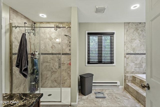 108 Bayberry Ct, East Stroudsburg, PA 18301 - bathroom featuring baseboard heating, a shower stall, a garden tub, and baseboards