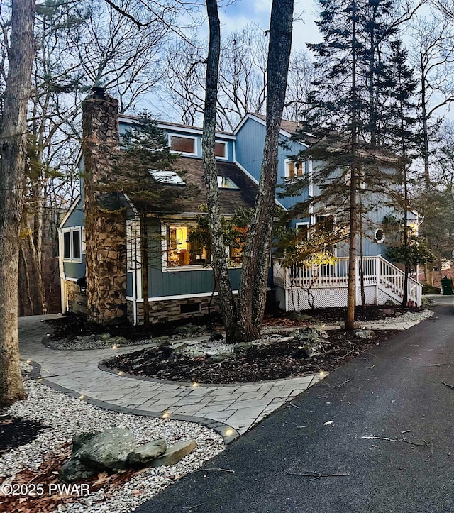 view of front of home featuring a chimney