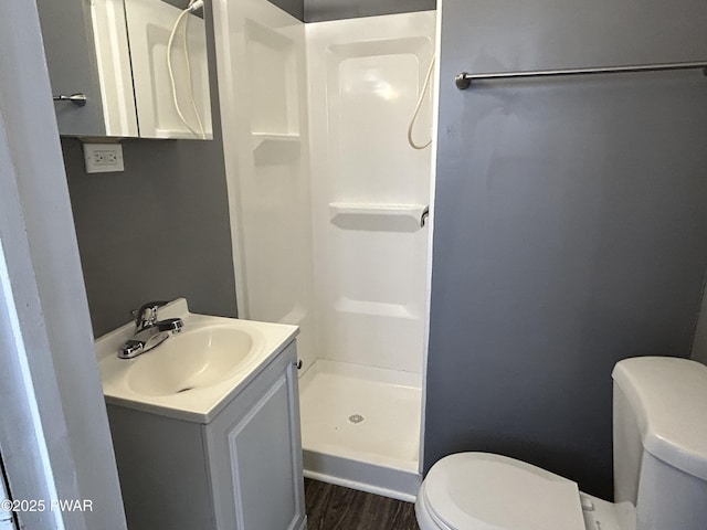 887 Maple Ave, Honesdale, PA 18431 - full bathroom featuring toilet, vanity, wood finished floors, and a stall shower