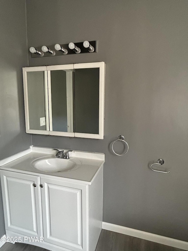 887 Maple Ave, Honesdale, PA 18431 - bathroom with baseboards, vanity, and wood finished floors