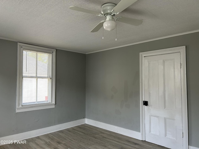 887 Maple Ave, Honesdale, PA 18431 - empty room with baseboards, dark wood-style flooring, ceiling fan, and a textured ceiling