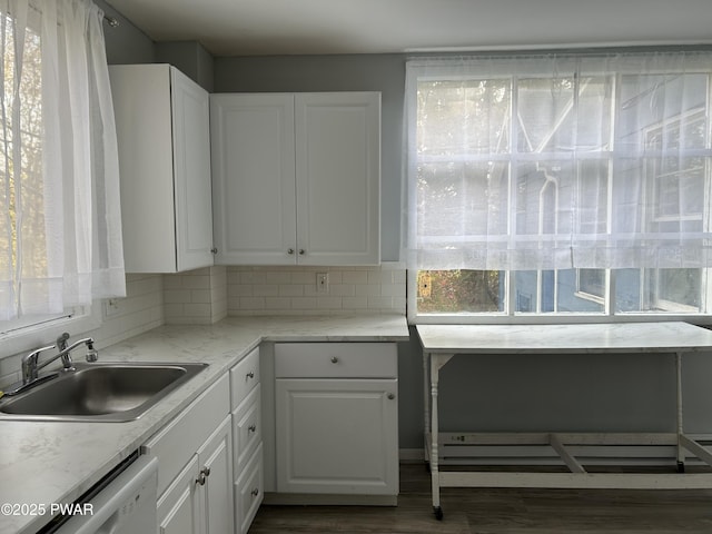 887 Maple Ave, Honesdale, PA 18431 - kitchen with dark wood finished floors, white cabinetry, dishwashing machine, and a sink