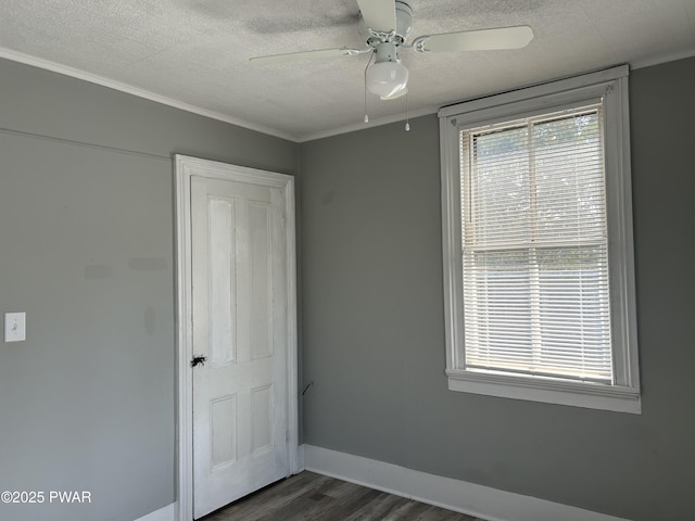 887 Maple Ave, Honesdale, PA 18431 - unfurnished bedroom with multiple windows, dark wood finished floors, and crown molding