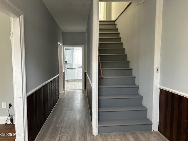 887 Maple Ave, Honesdale, PA 18431 - stairway featuring a wainscoted wall and wood finished floors