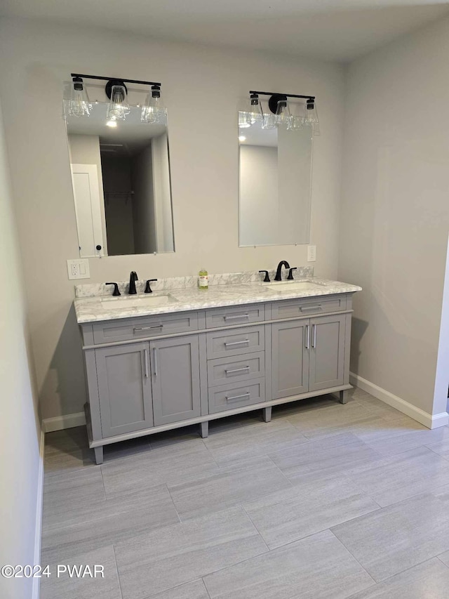 bathroom featuring tile patterned flooring and vanity