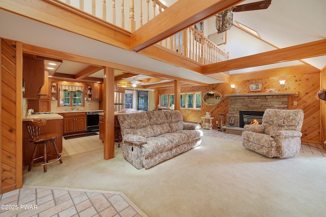 109 Glenbrook Dr, Dingmans Ferry, PA 18328 - living room with wooden walls, light colored carpet, a high ceiling, healthy amount of natural light, and a ceiling fan